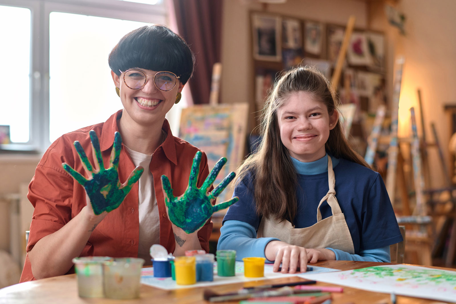 Girl with a disability smiling at the camera