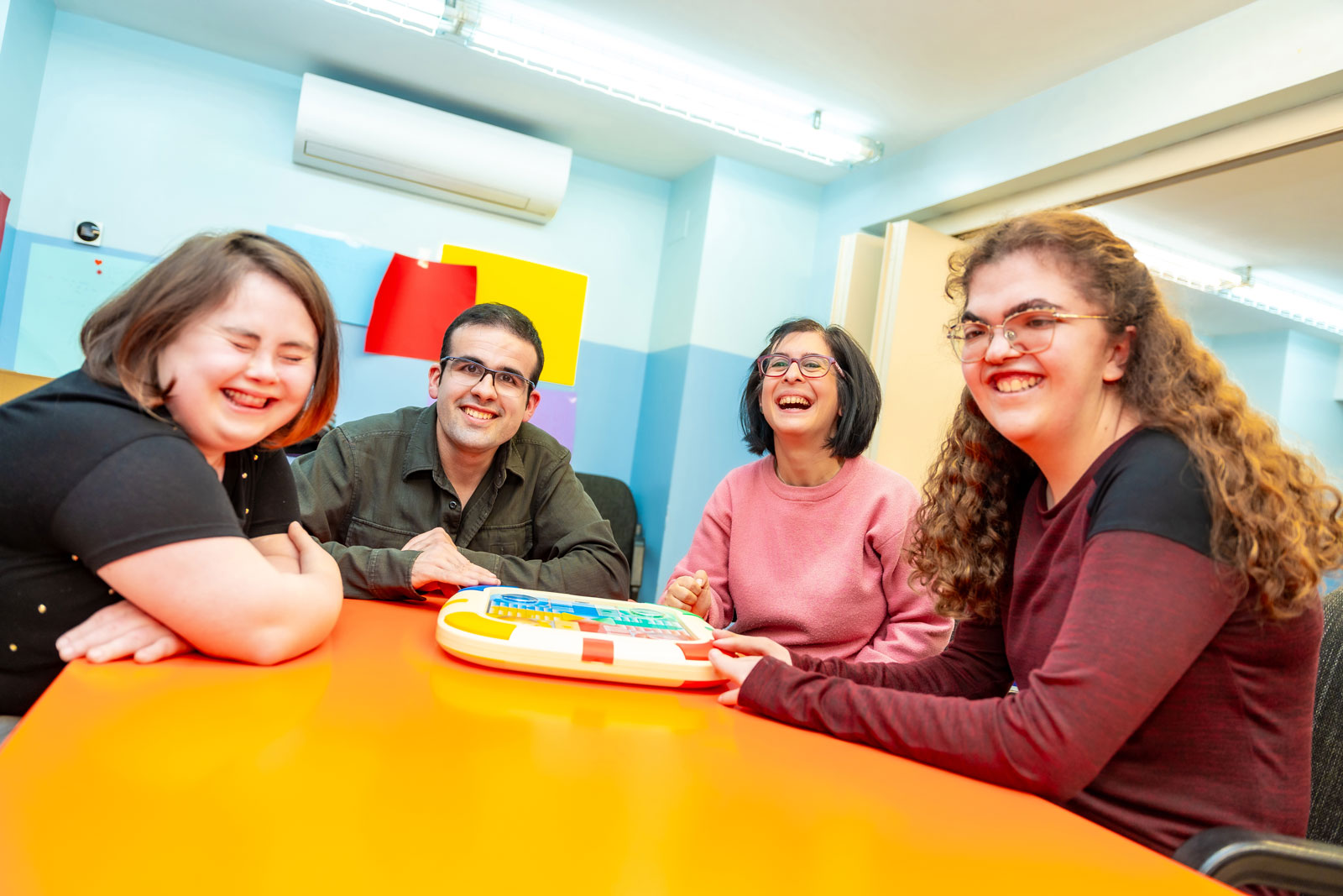 Therapist playing a board game with a learner